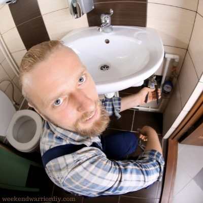 plumber changing bathroom sink
