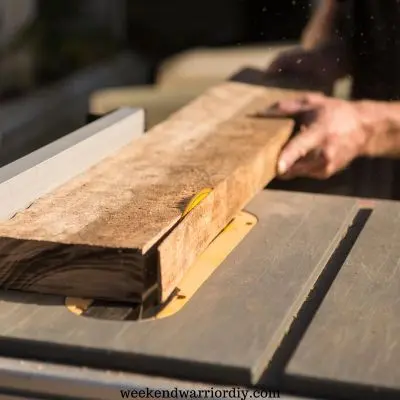 table saw cutting wood